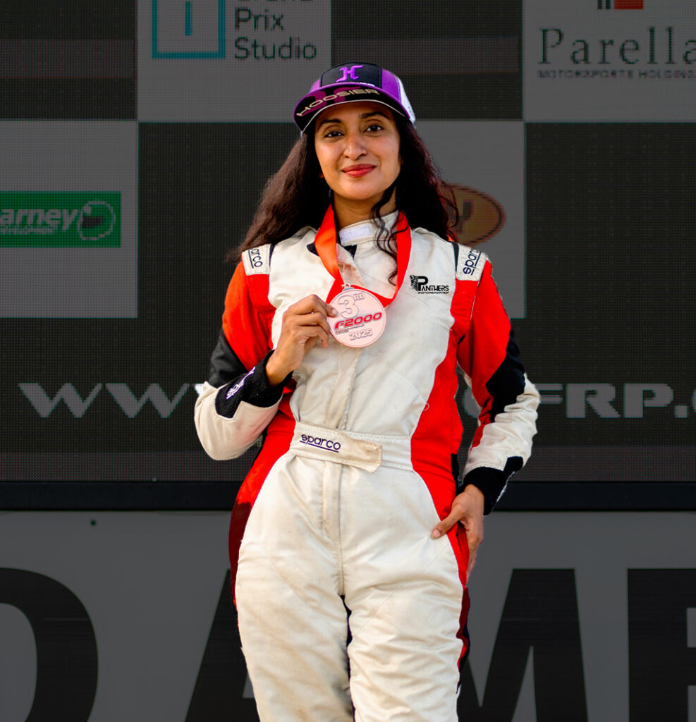 Woman racing driver in the paddock